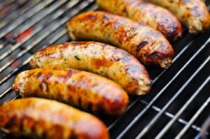 chicken sausage on BBQ perfect for summer