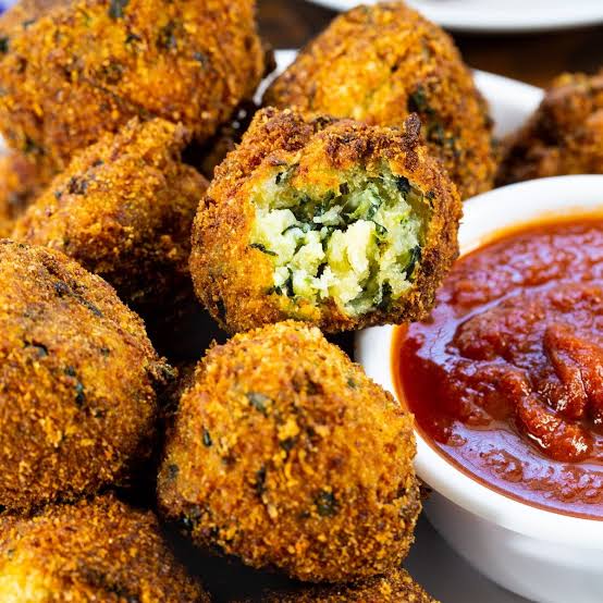 Deep fried spinach balls with a dip 