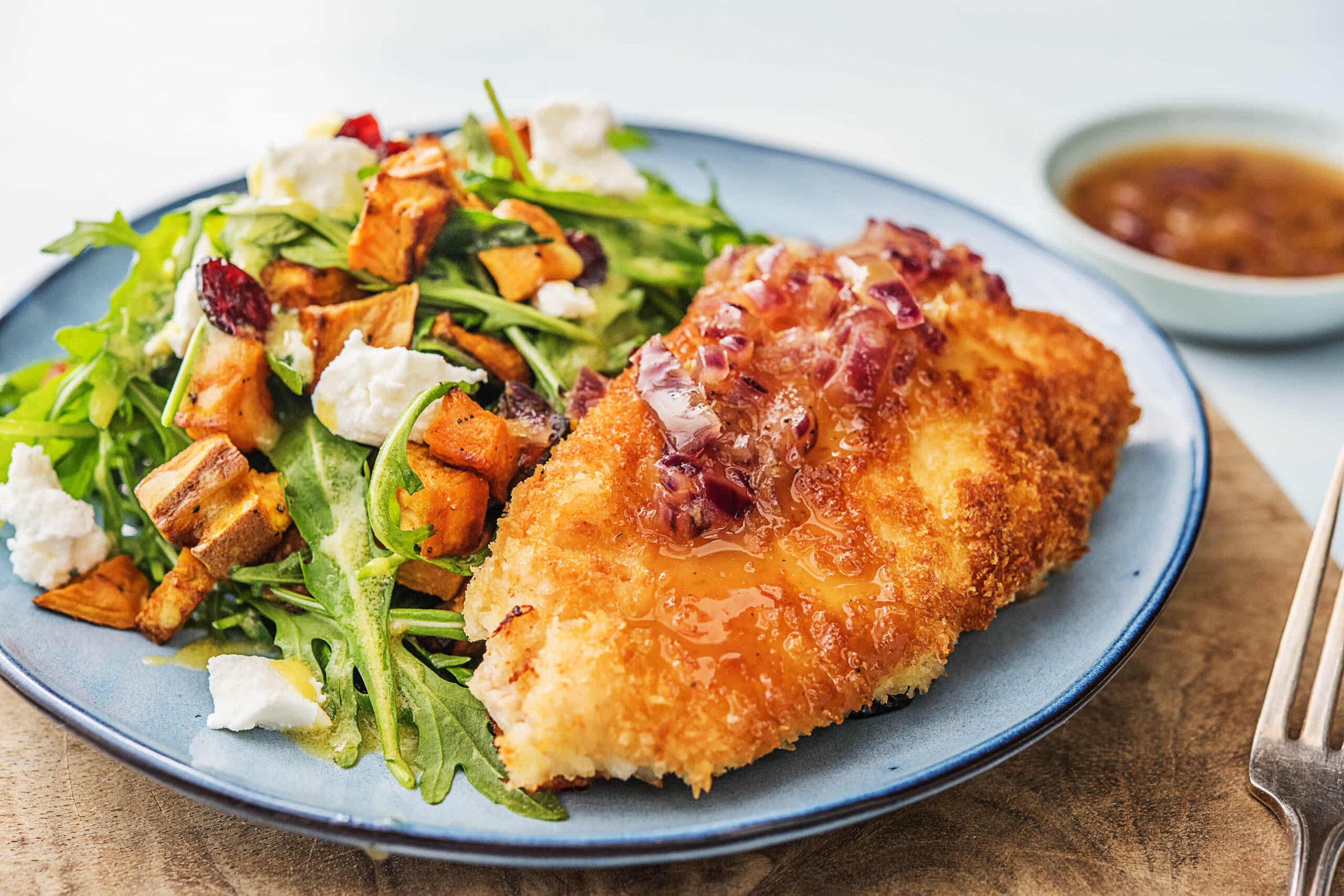 panko crusted chicken with salad and sweet potatoes and beetroot