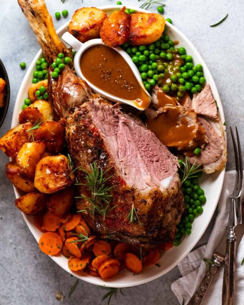 roast lamb dinner with potatoes and peas