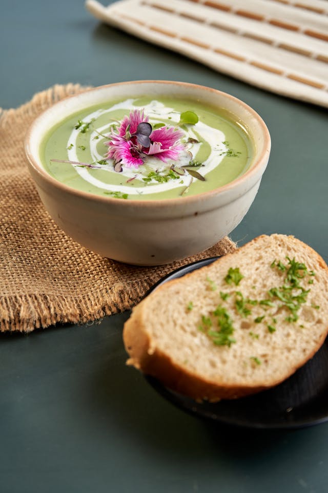Creamy pea soup with slice of bread 