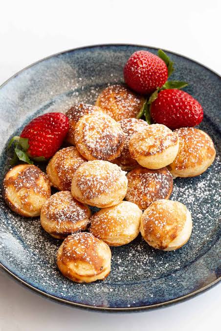 Easy Dutch poffertjies with chocolate and strawberries. 