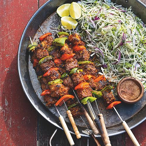 Beef suya skewers with salad